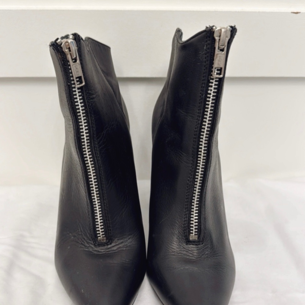 Black Heeled Boots with Sleek Design and Silver Zippers